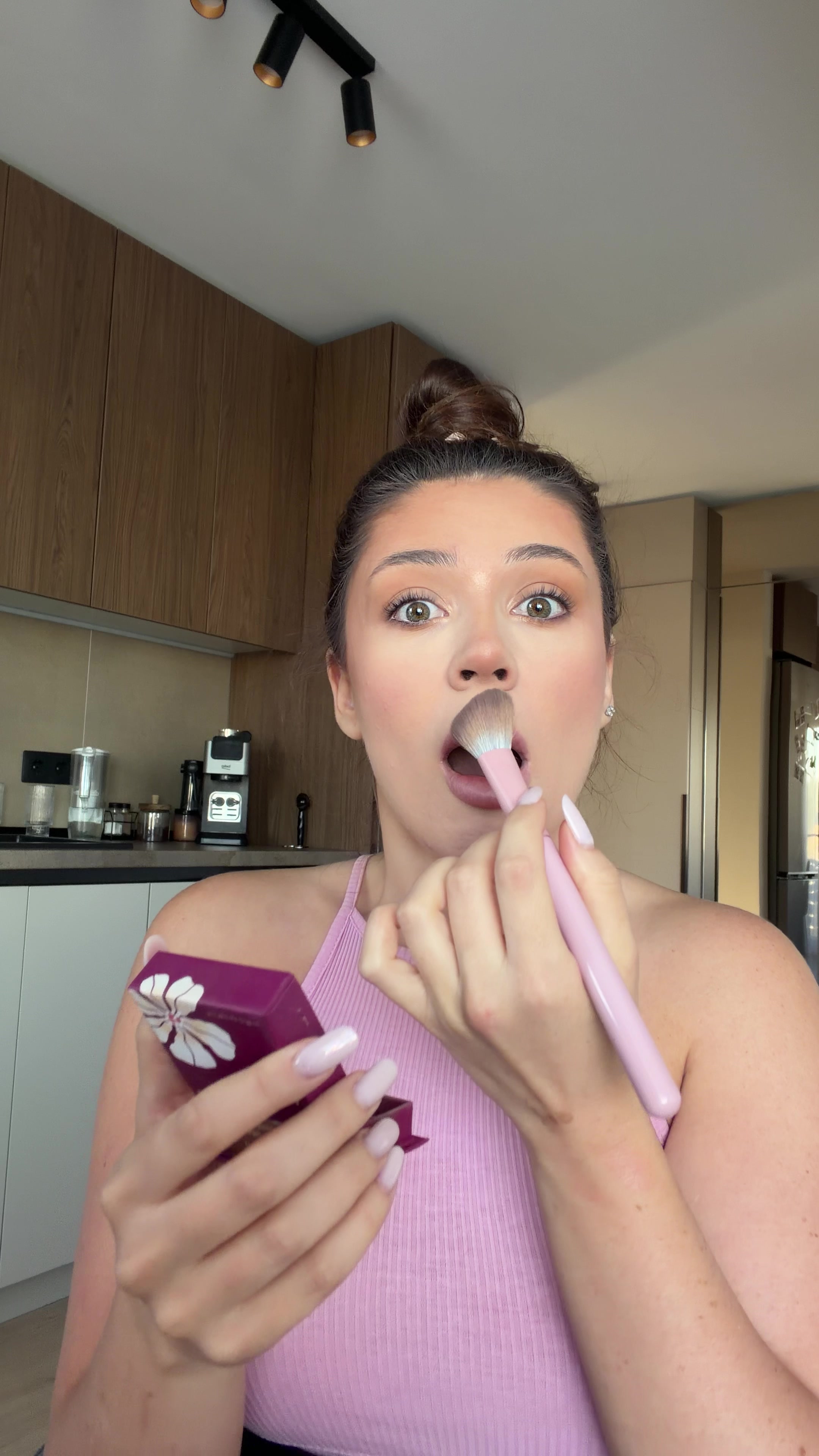 Woman gets surprised while applying makeup