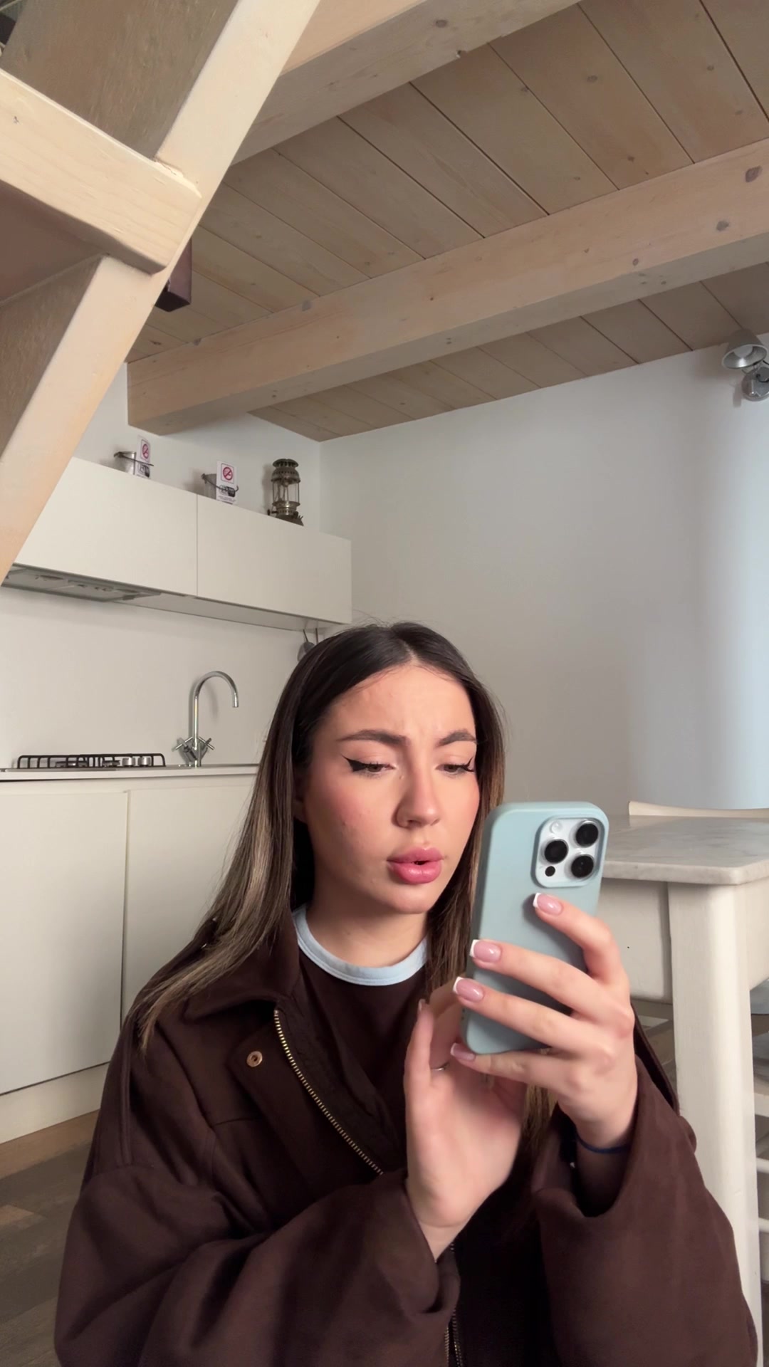 Woman reacts with surprise to phone