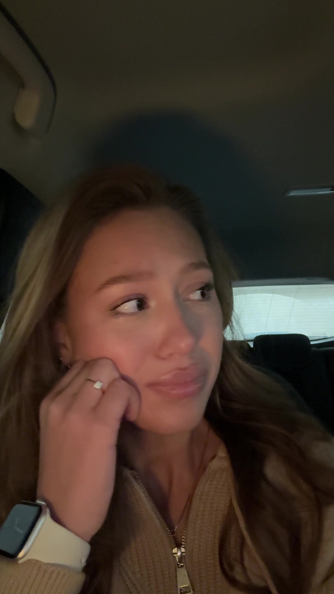 Angelika Suppressing Laughter in Car