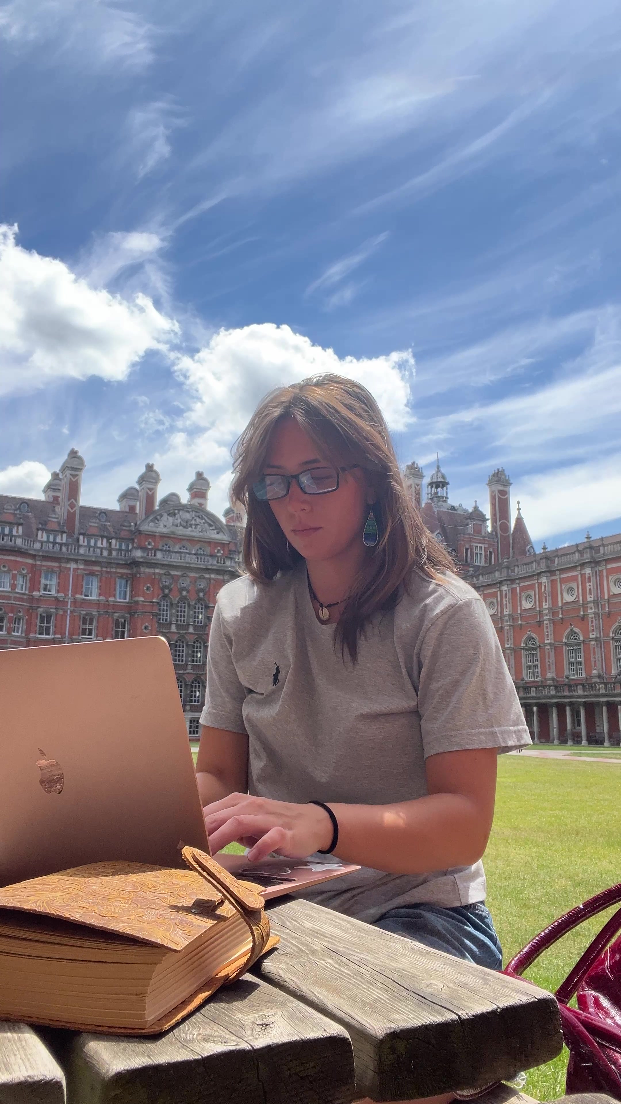 Emilia Working Outdoors on Laptop
