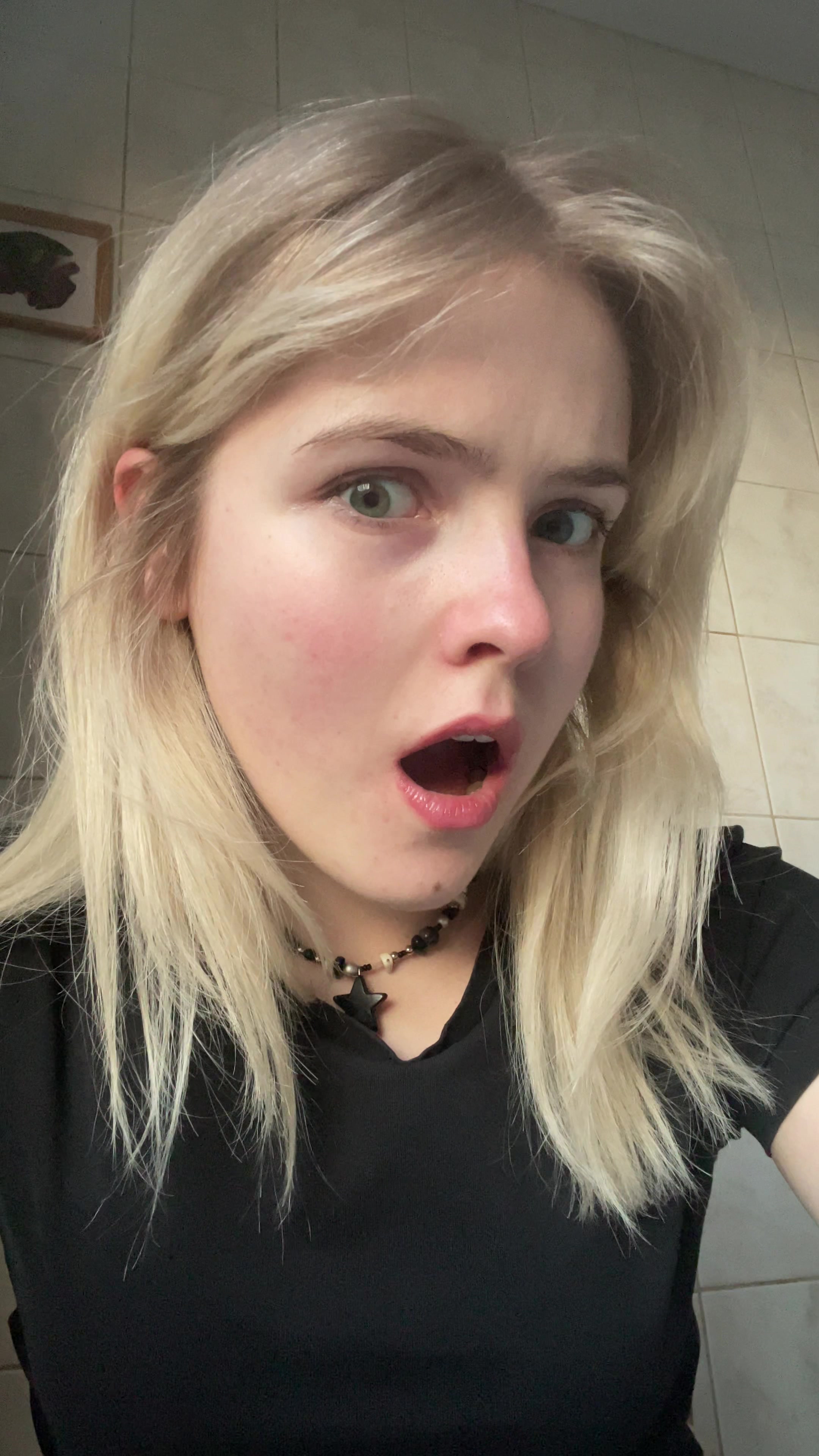 Blonde Girl's Surprised to Playful Reaction