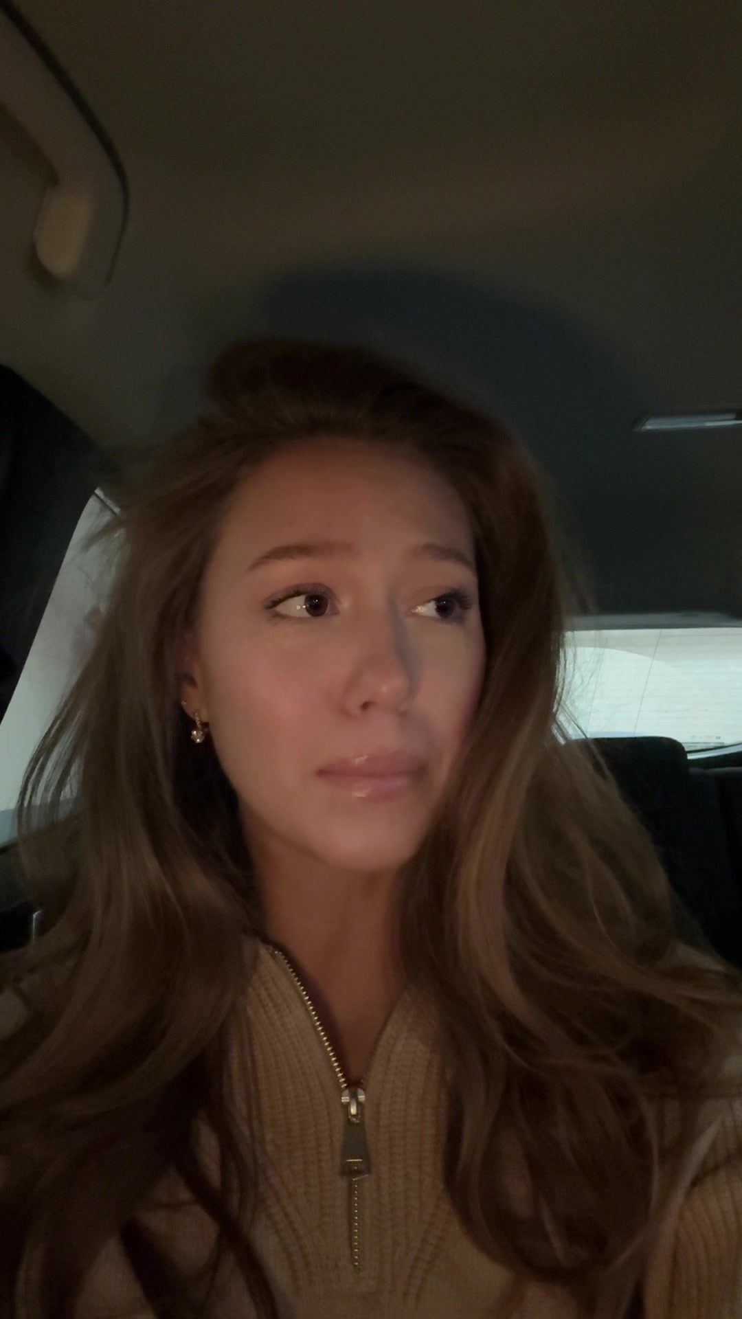 Woman playfully crying in car
