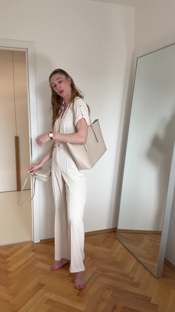 Woman Posing with Different Handbags