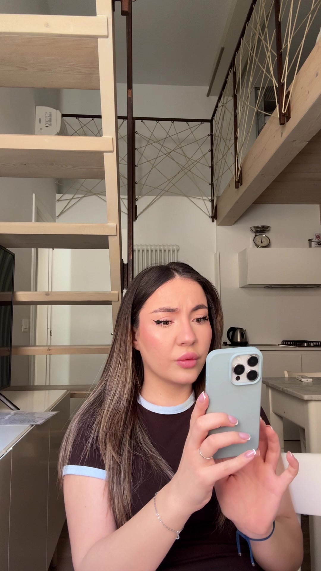 Sofia Smiling at Phone Screen
