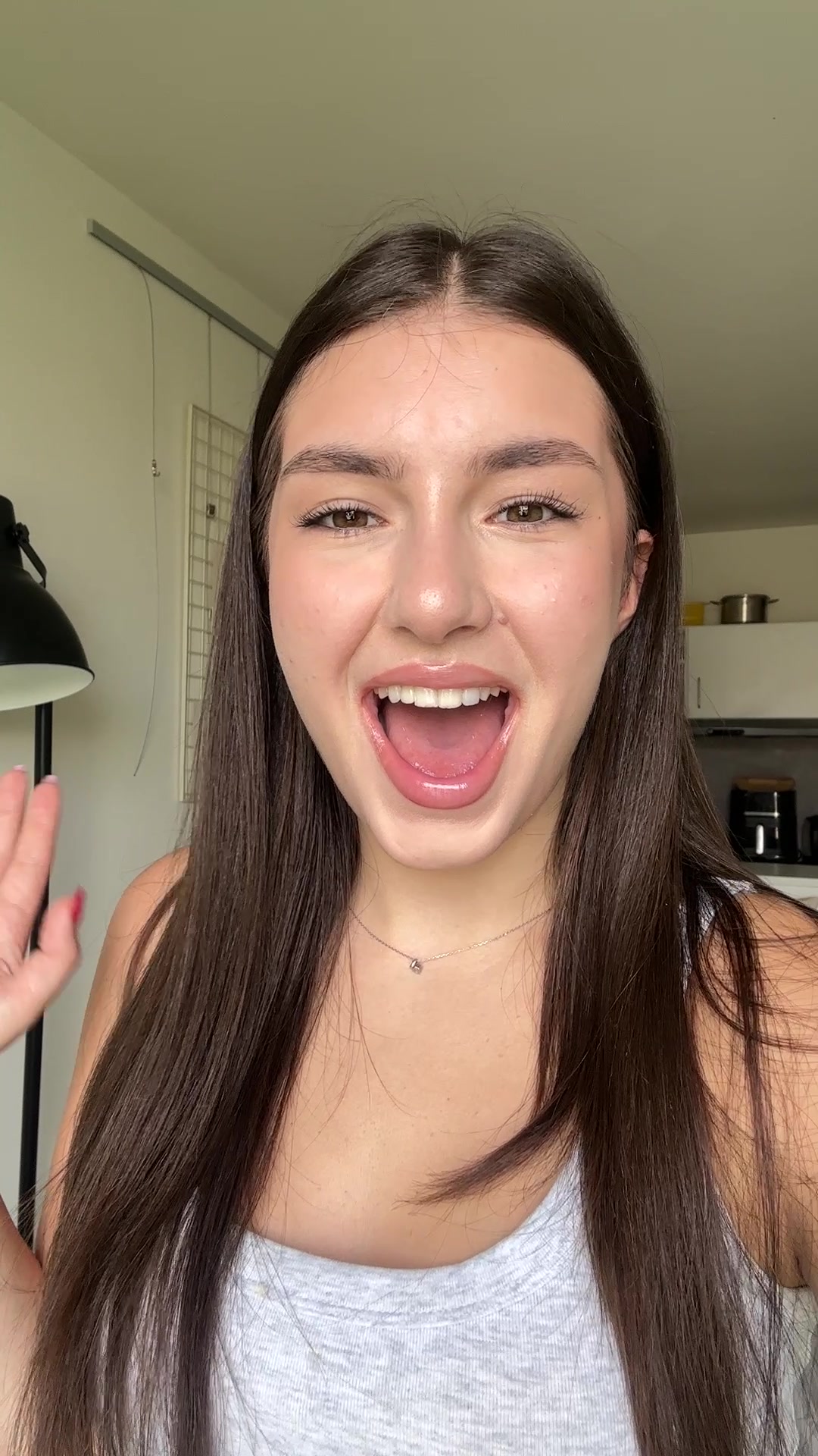 Andrea's Playful Laugh to Confident Stare