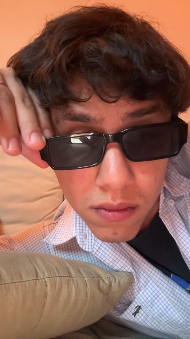 Man Lowers Sunglasses, Reveals Eyes