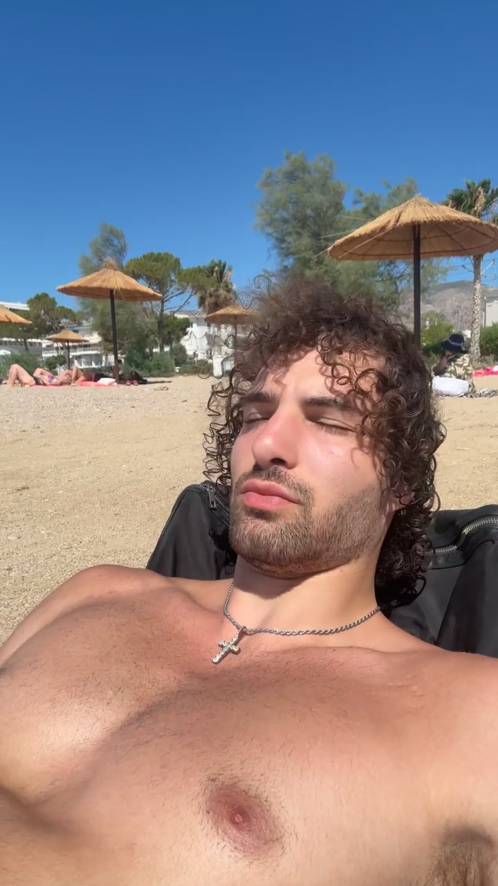Man Relaxing on Sunny Beach