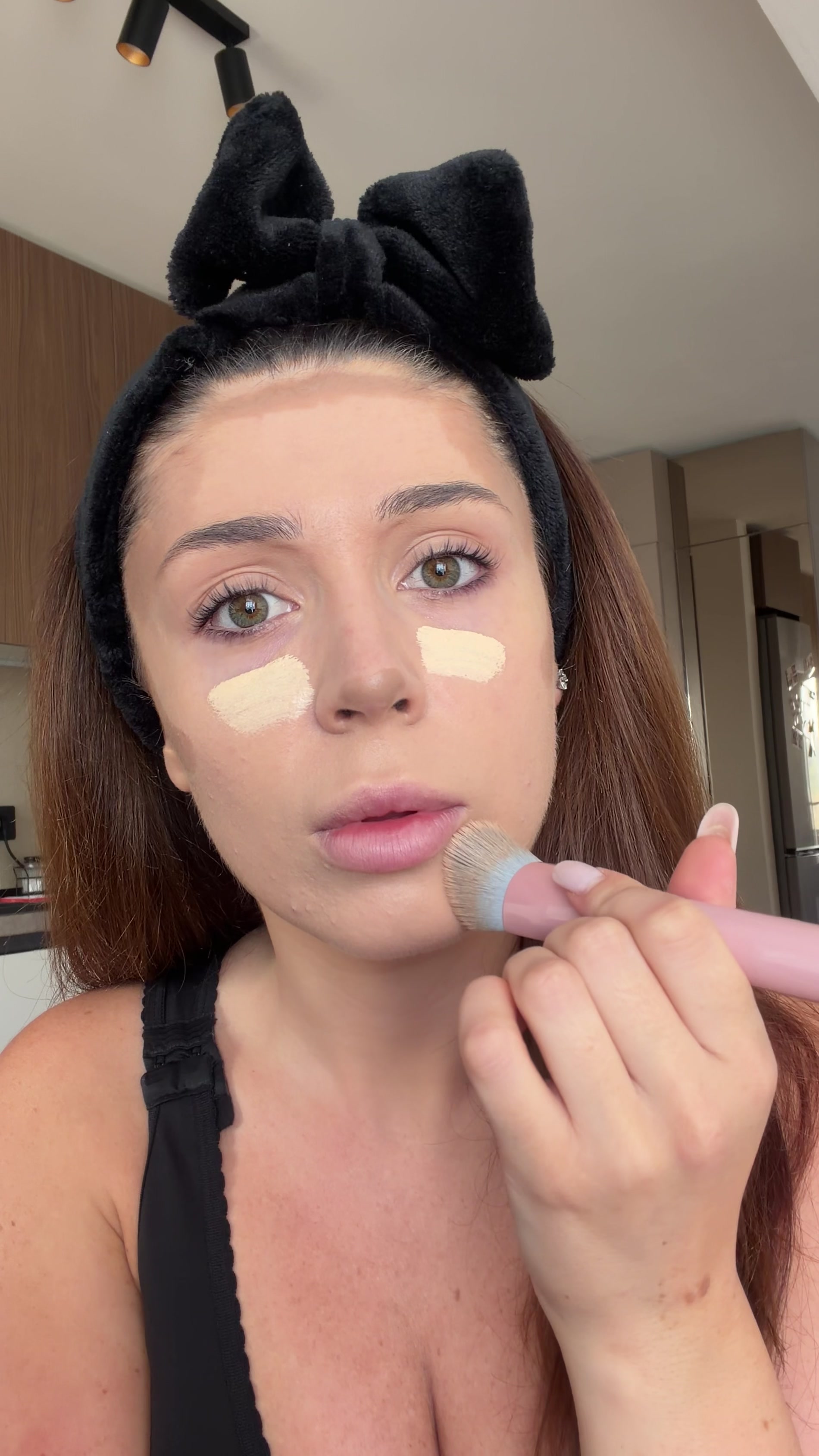 Woman reacts in shock during makeup