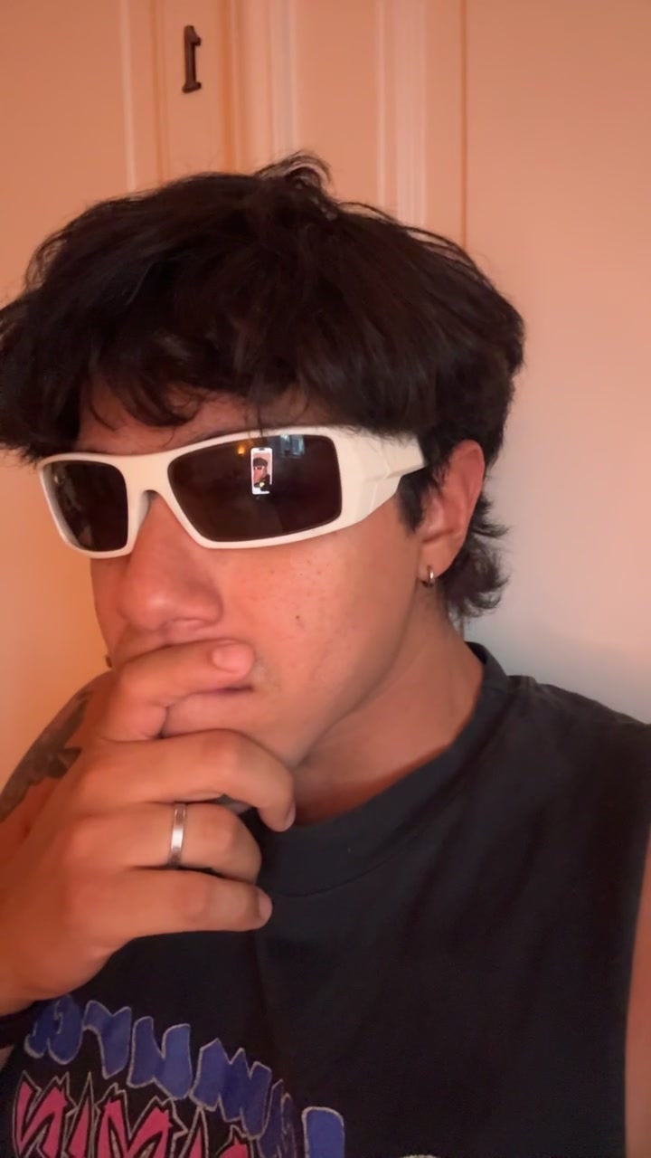 Carlos' Curious Glance in White Sunglasses
