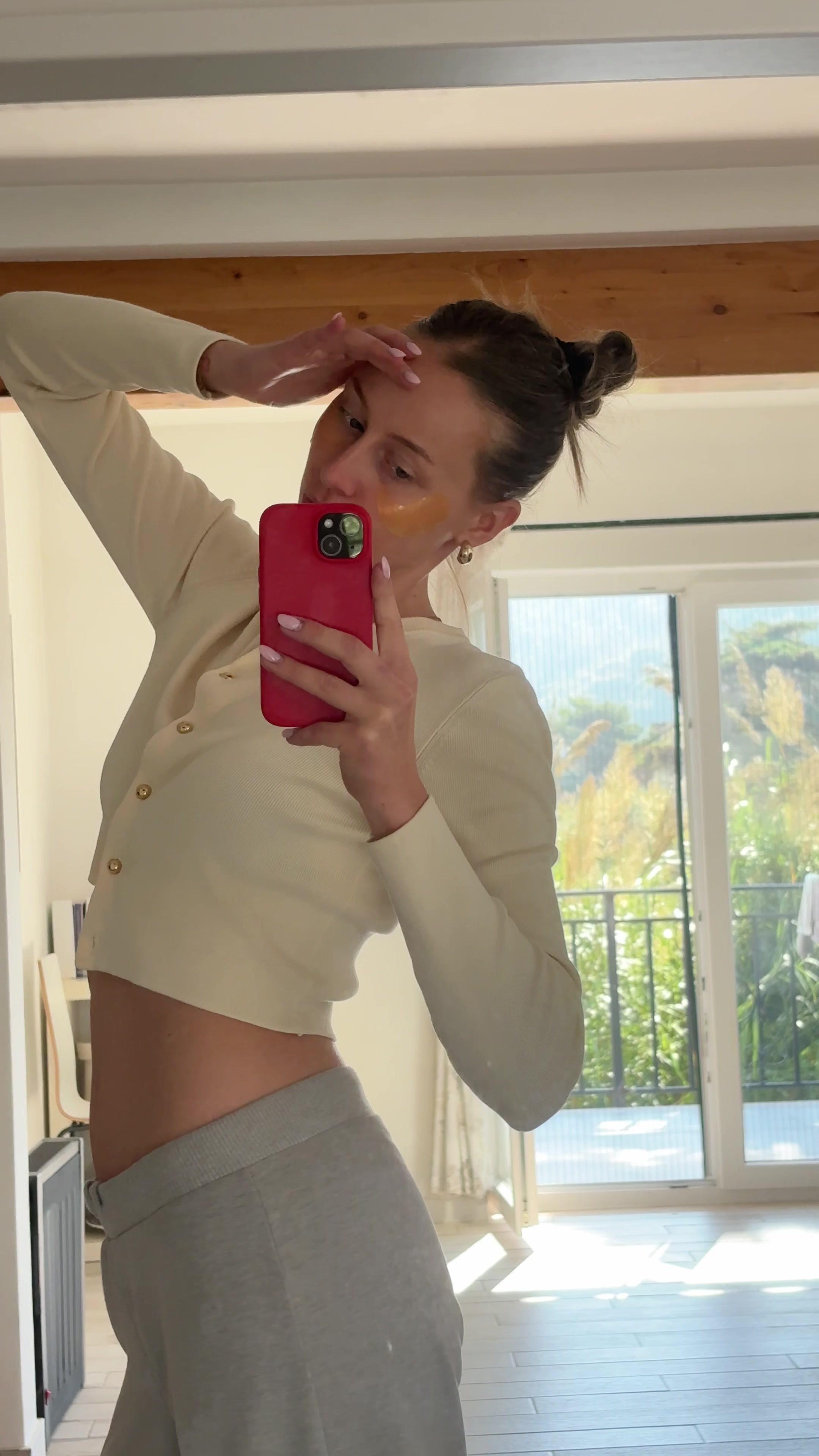 Woman Posing in Mirror With Eye Patches