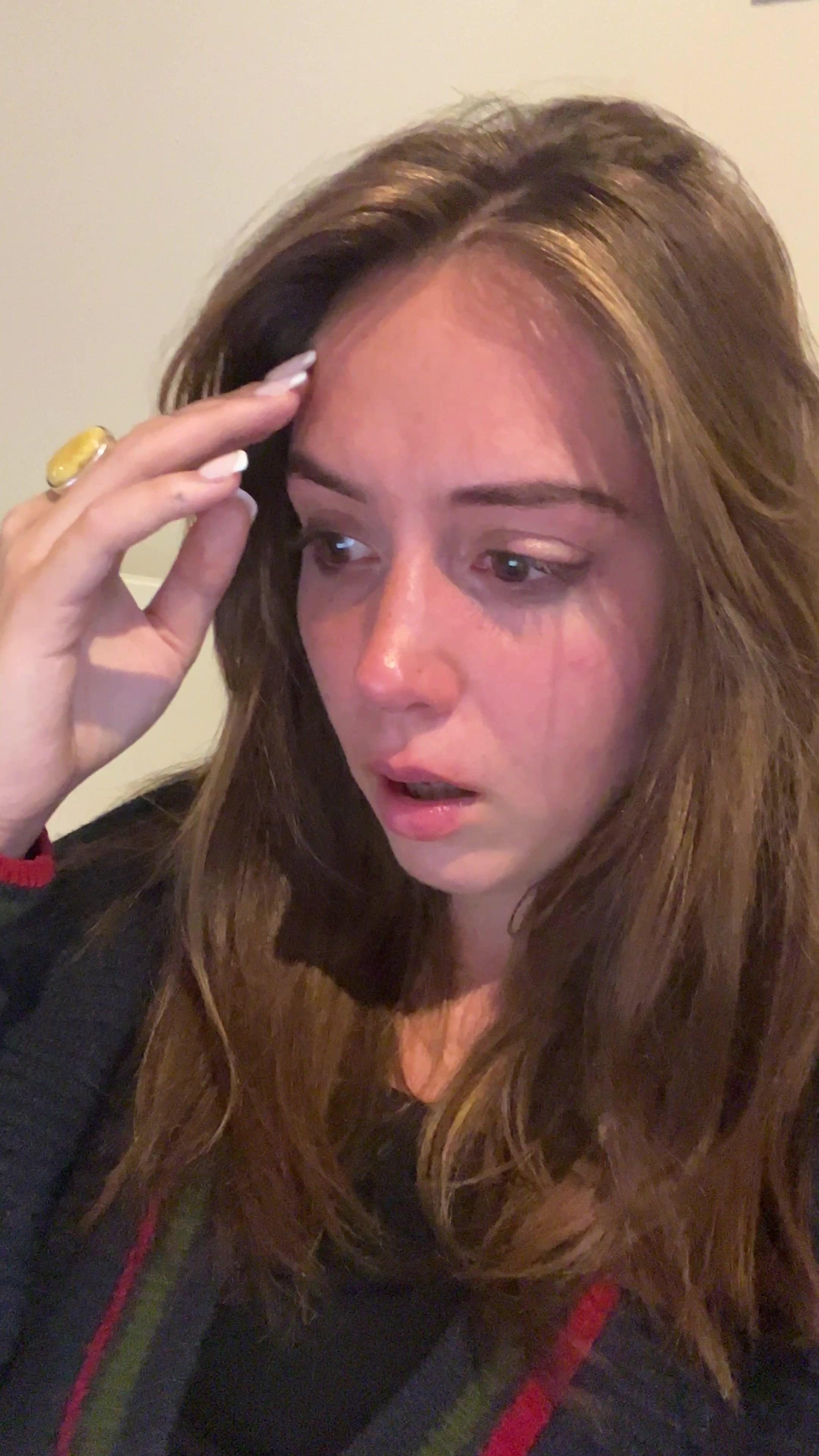 Young Woman Crying and Looking Distressed