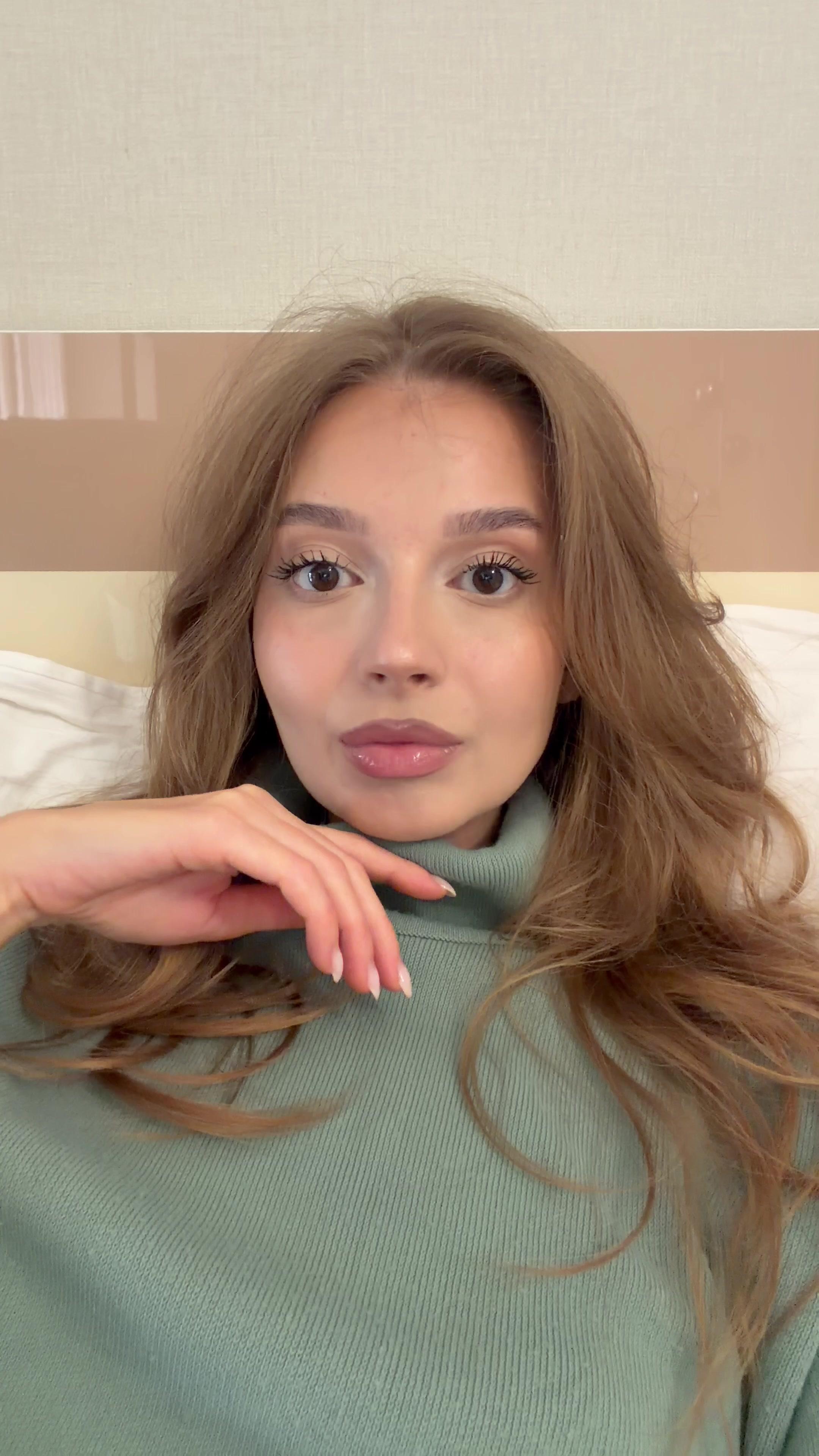 Woman Looking Shocked and Covering Mouth