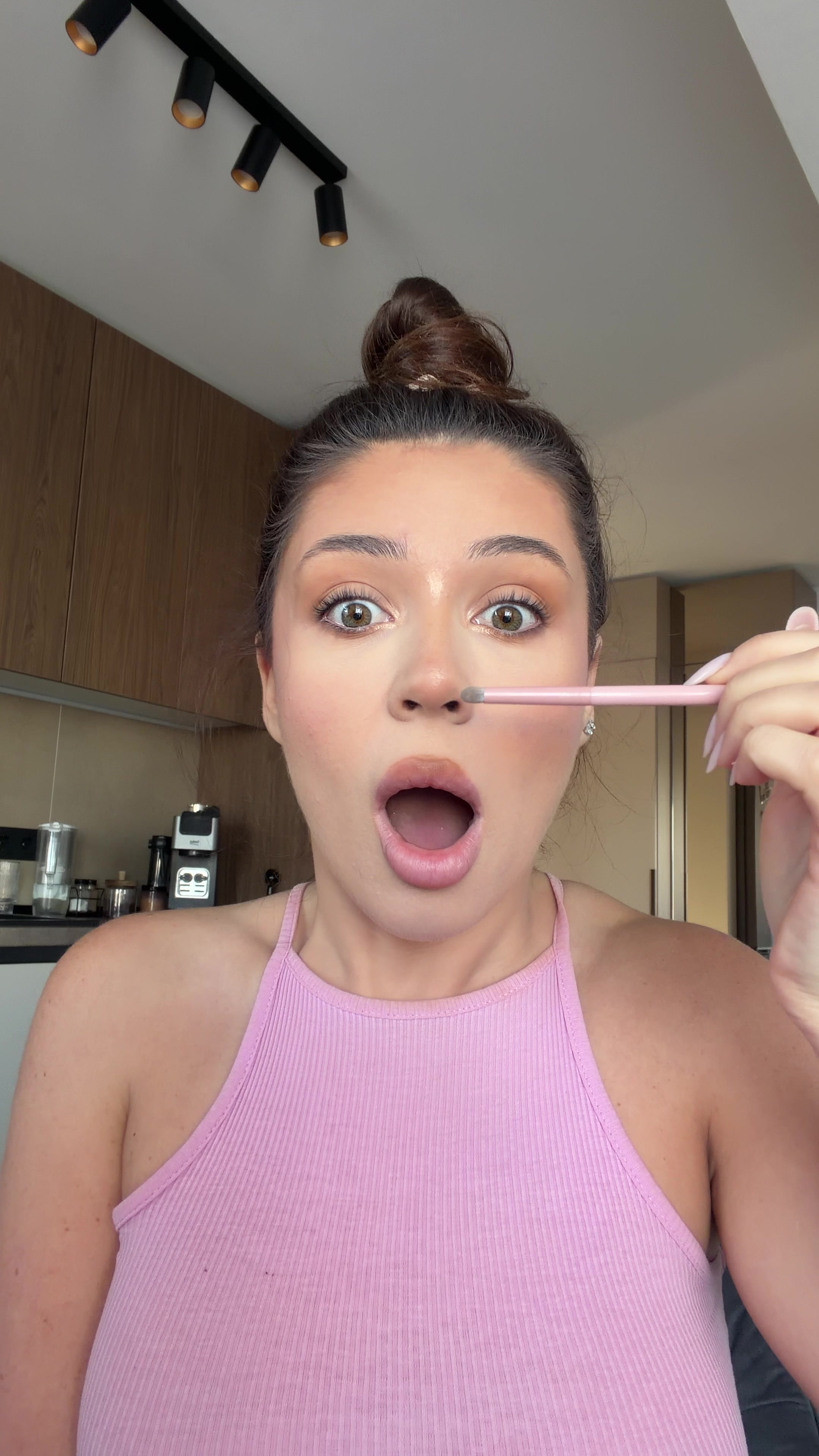 Woman shocked, covers mouth