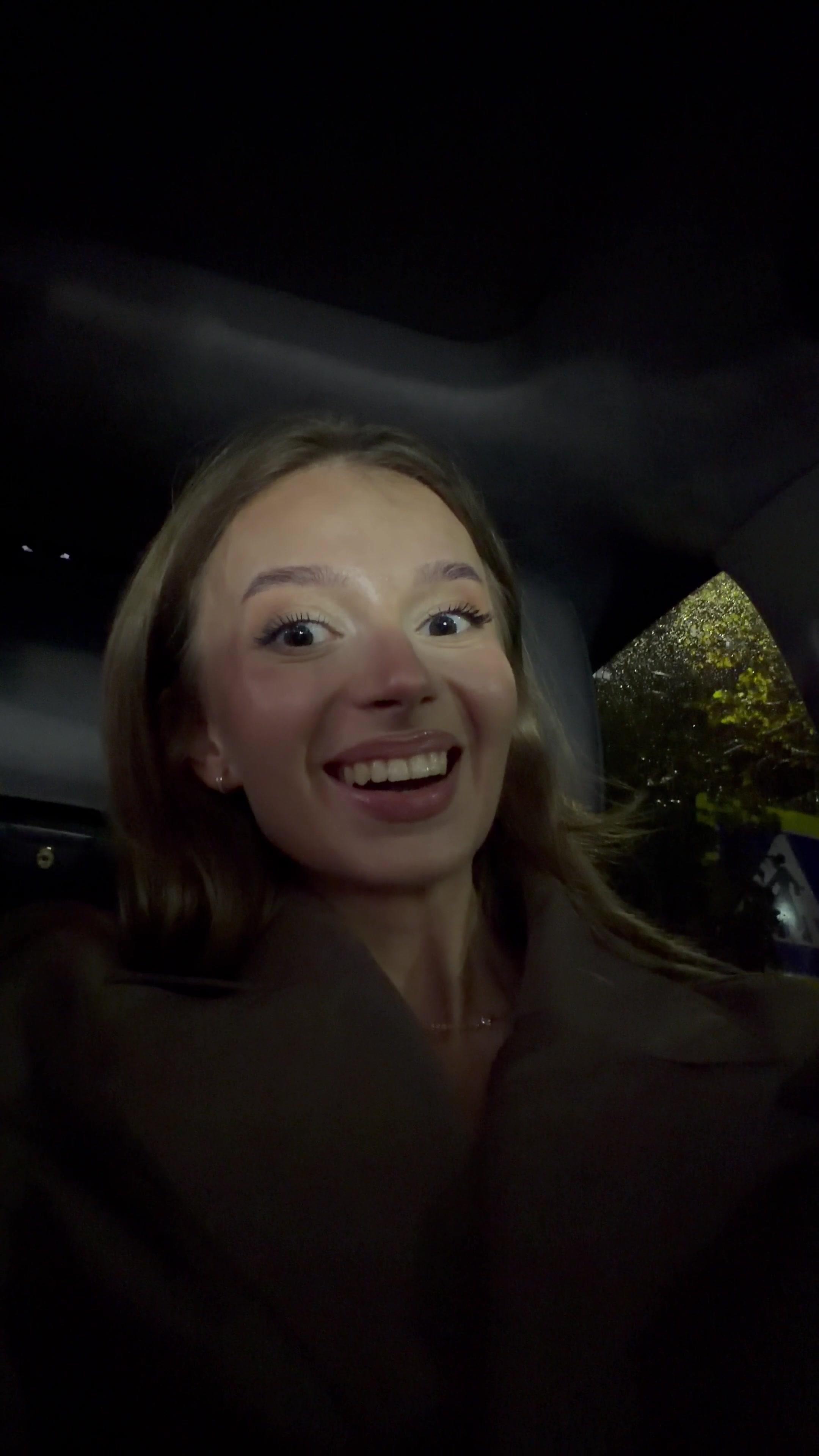 Excited Young Woman Reacting Inside Car