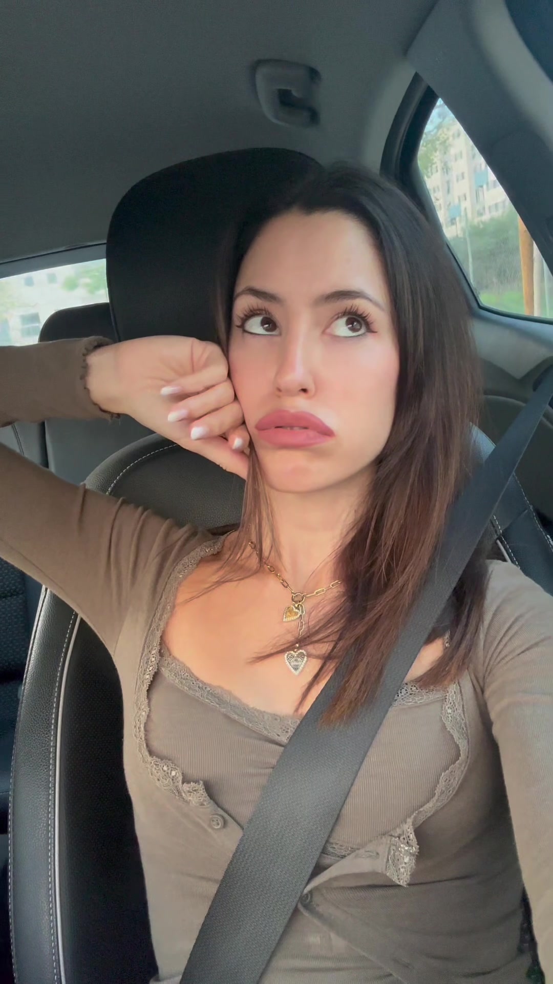 Woman Expresses Sadness While Driving